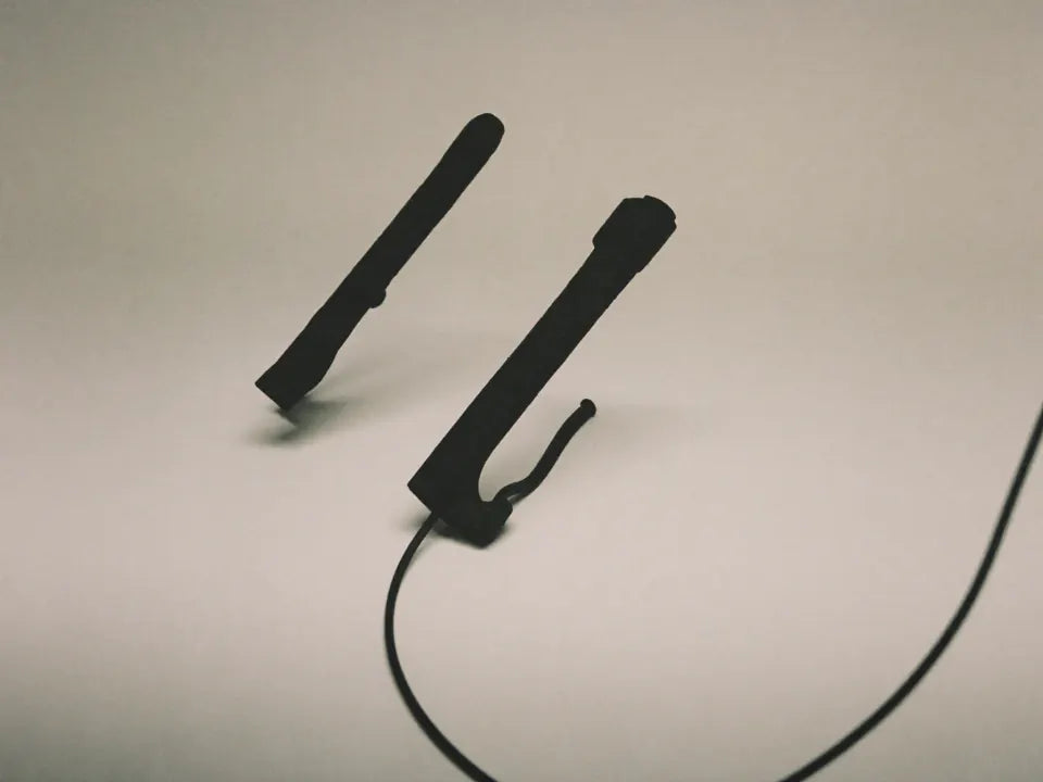 A motorcycle handlebar grip with a wiring loom