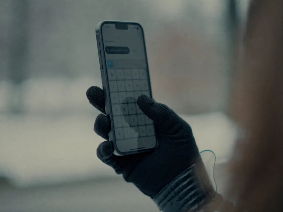 Using a phone while wearing a slim heated glove